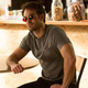 Daredevil/Matt Murdock sitting at a table.